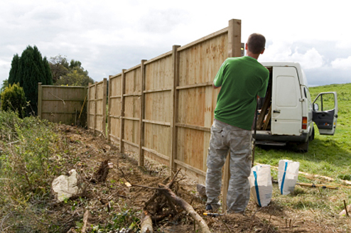 Fencing Contractor working on a fence installation